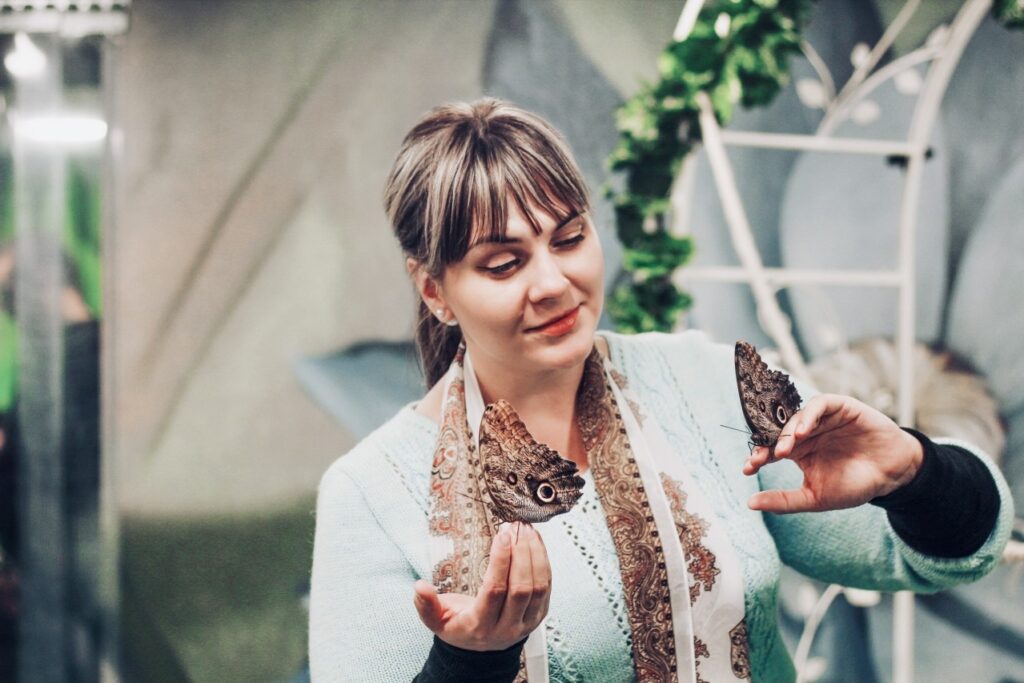 woman with moths on her hands