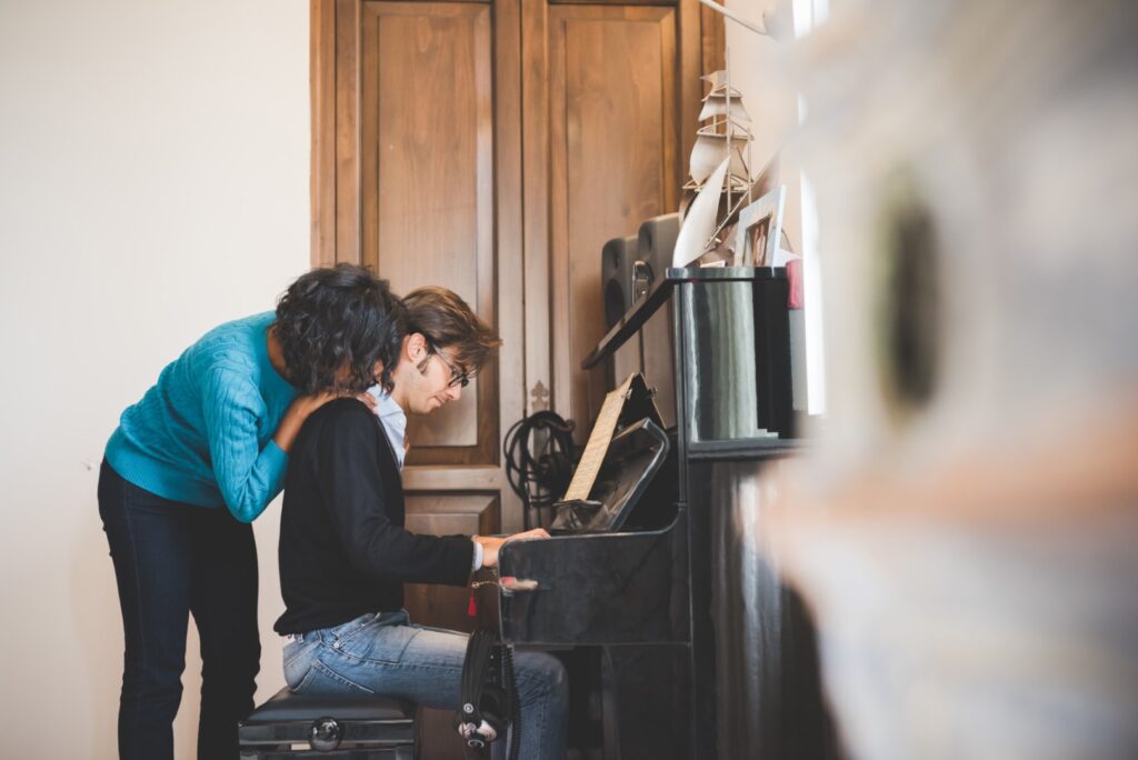 Couple spending time together playing piano