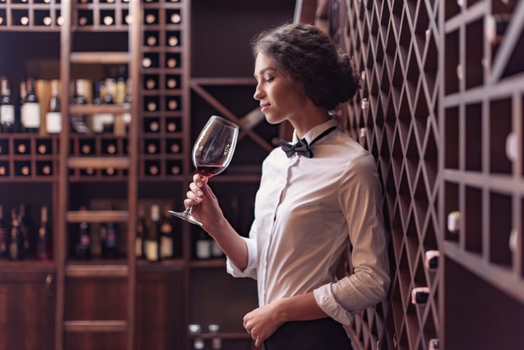 Female sommelier doing a wine tasting intullectual hobby
